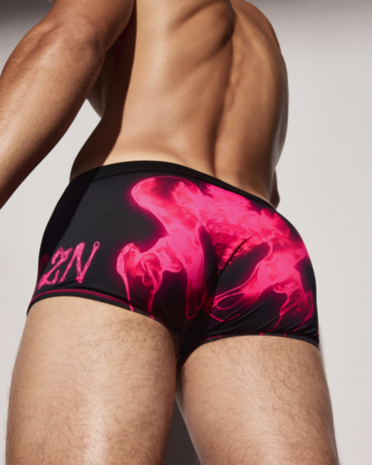 BSZN Pink X-ray pelvic print on model, rear three-quarter view.