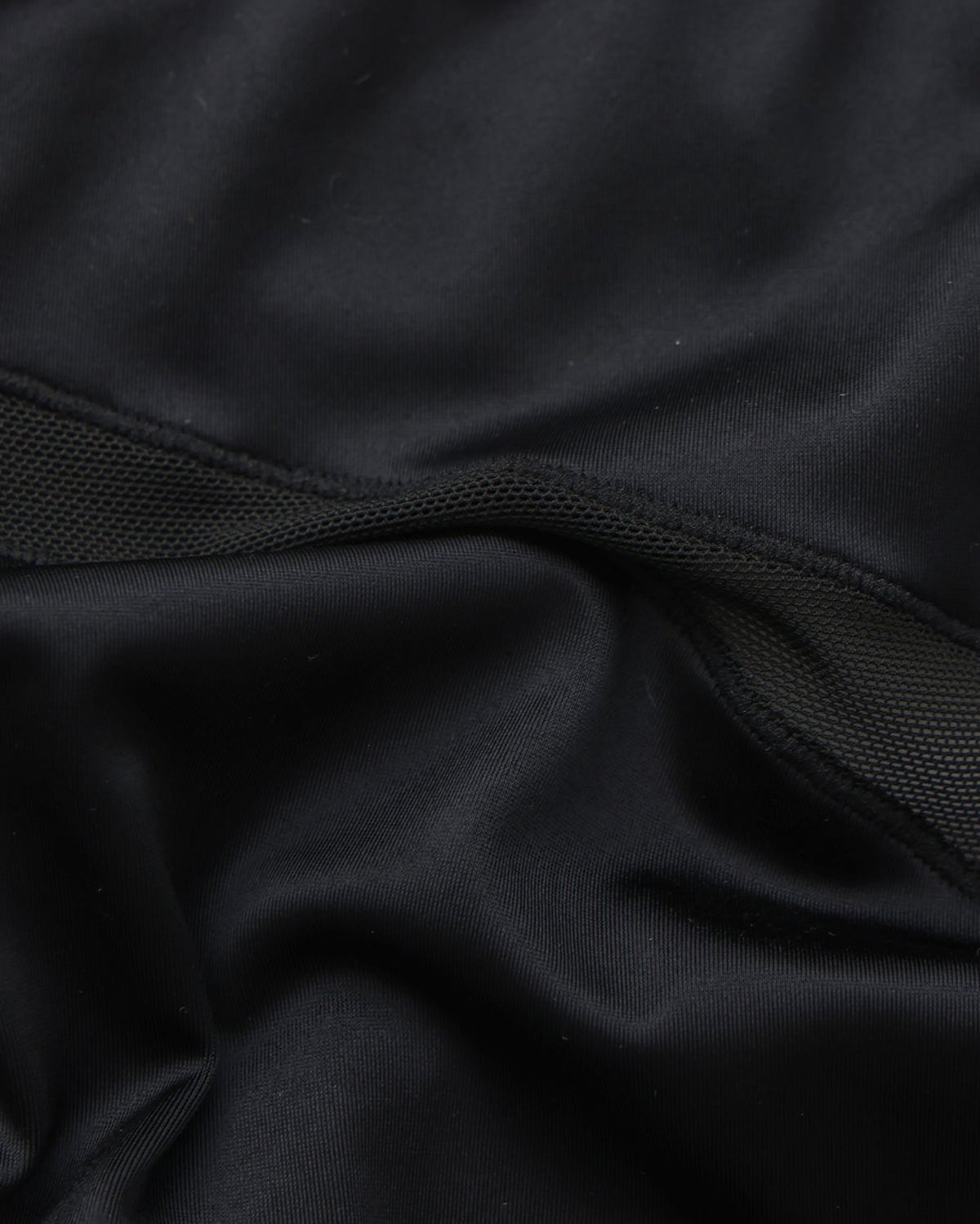BSZN Midnight Shimmer Mesh-Panel Brief — Black satin-look fabric close-up.