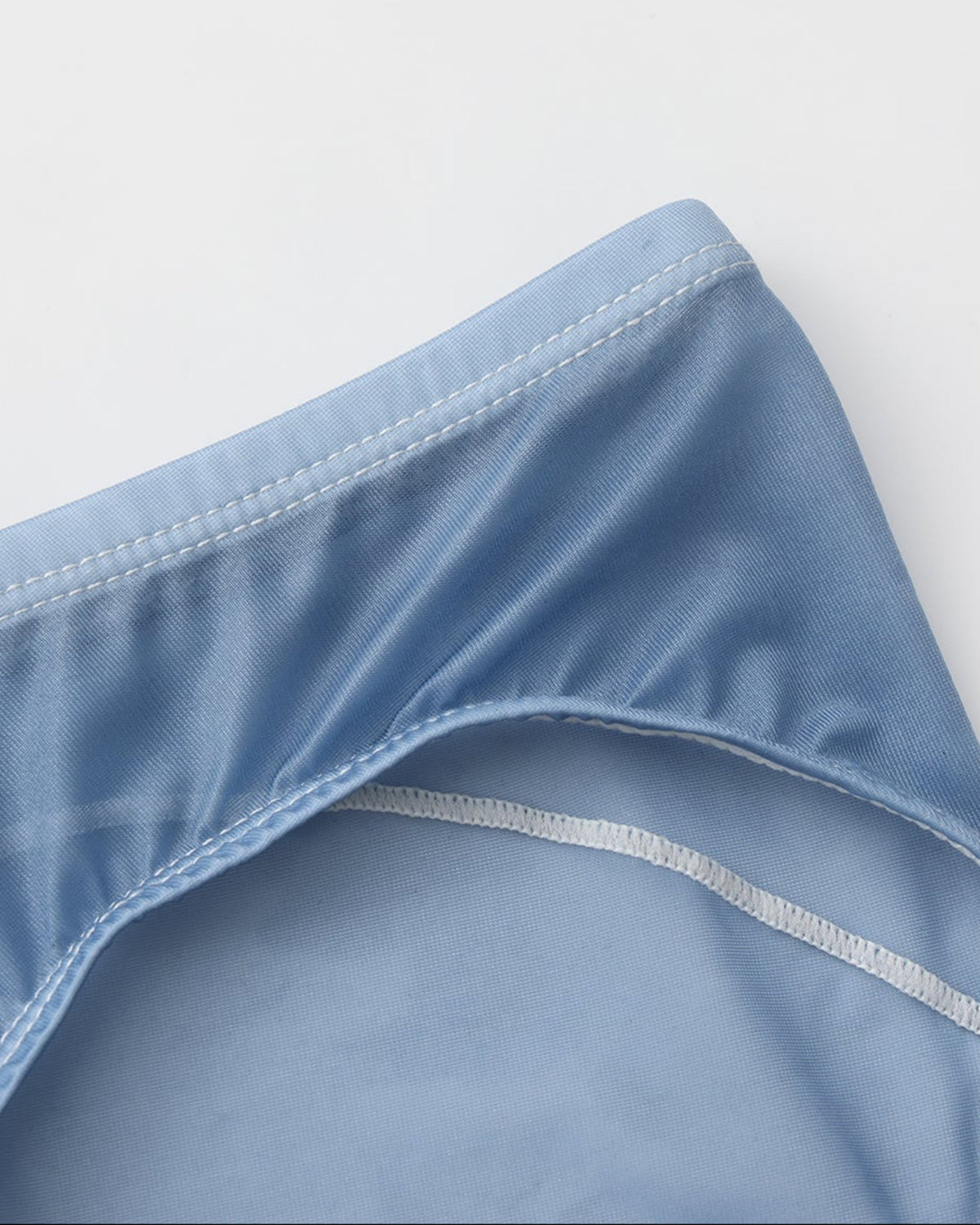 BSZN Sheer Contrast-Seam Brief — Blue waist and leg opening detail.