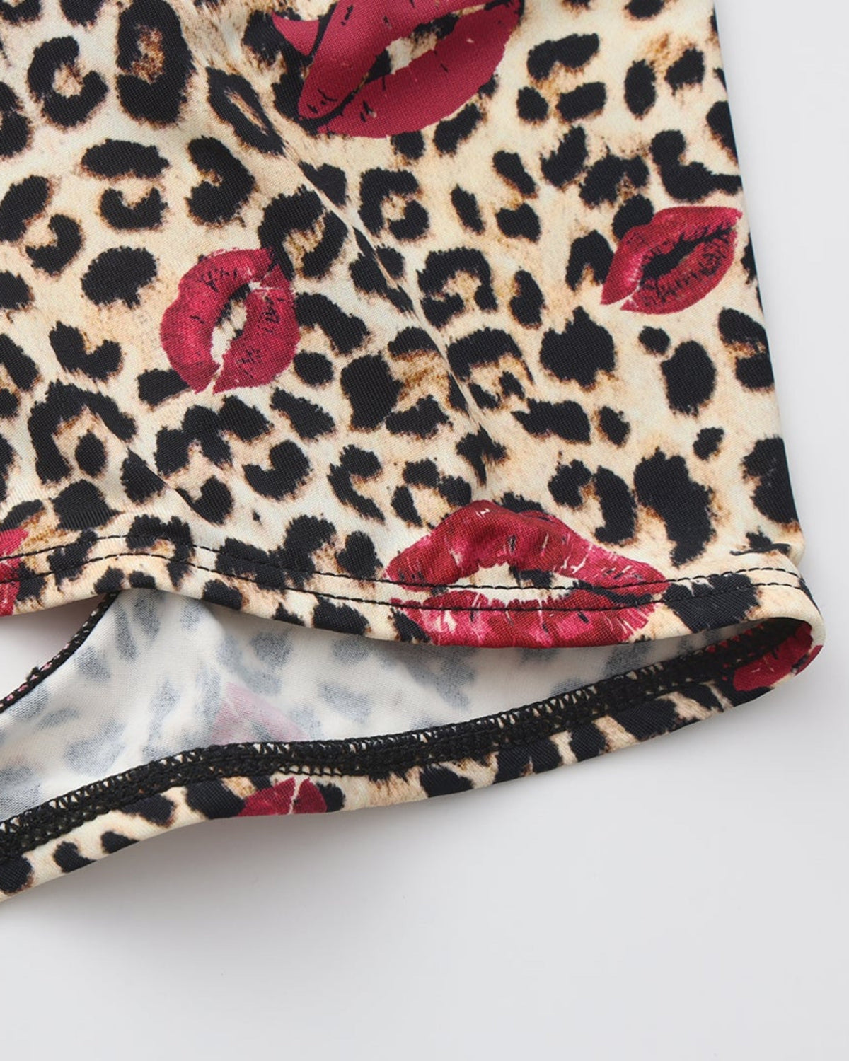BSZN Wild Kiss Open-Back Trunk — Brown leopard leg hem detail.