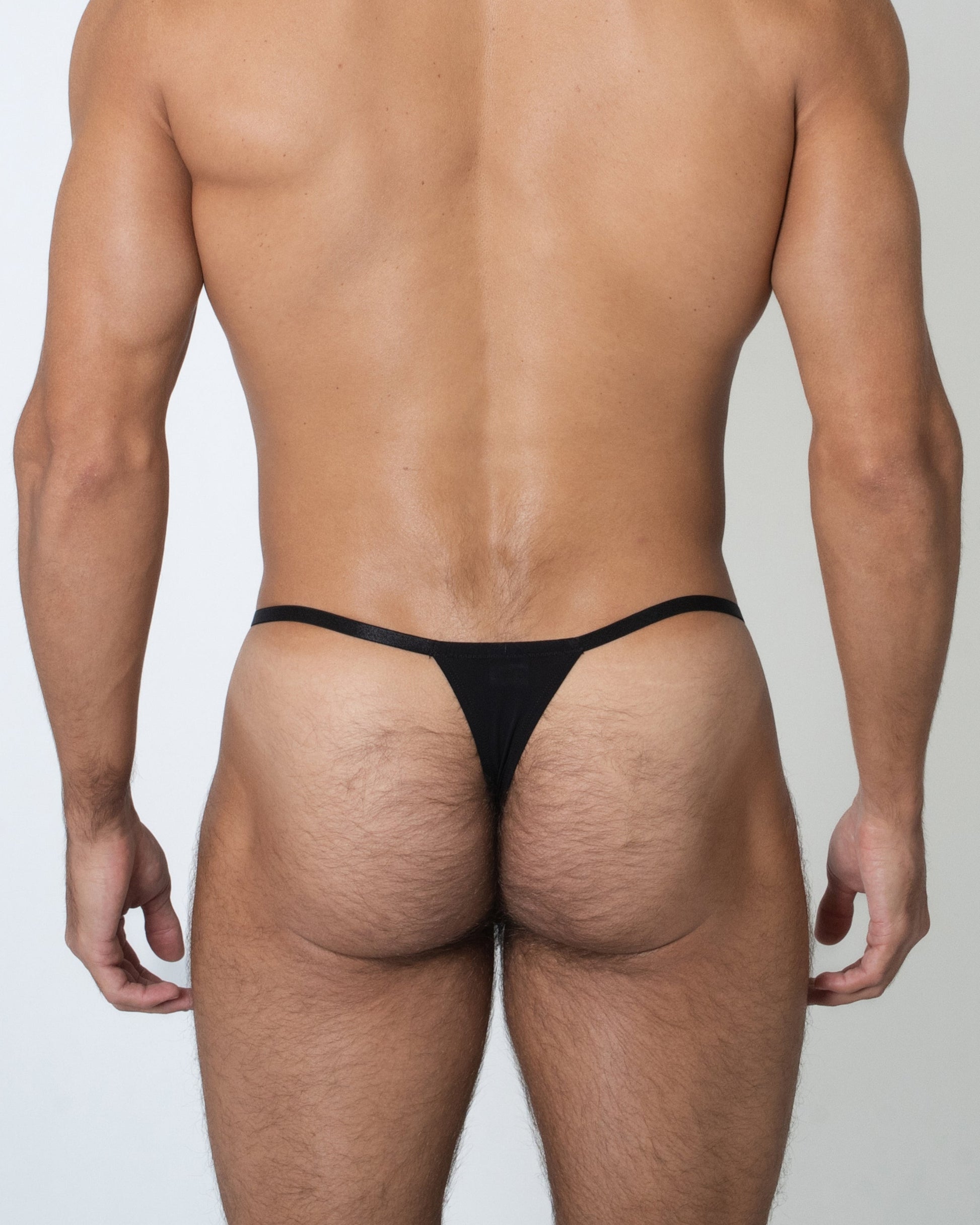 Model wearing the BSZN Ocean Starfish Hardware Thong, back view
