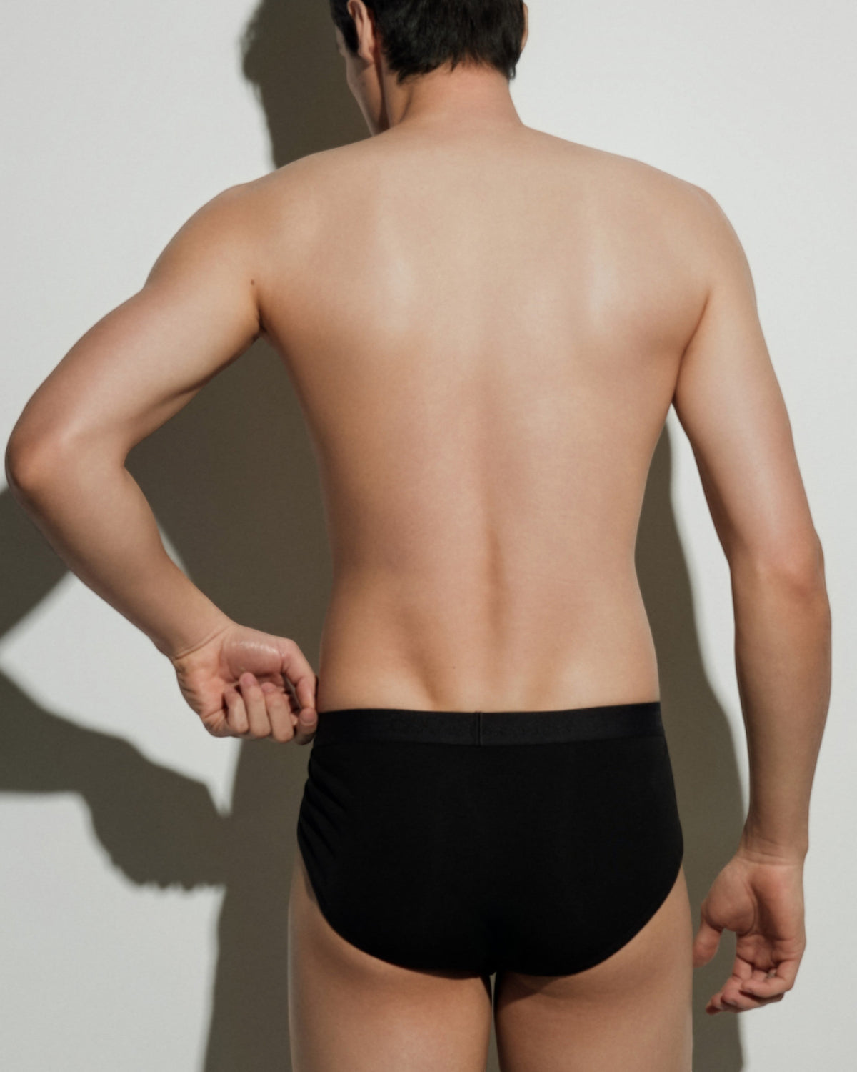BSZN Thorn Print High-Cut Brief, in black on model, rear view