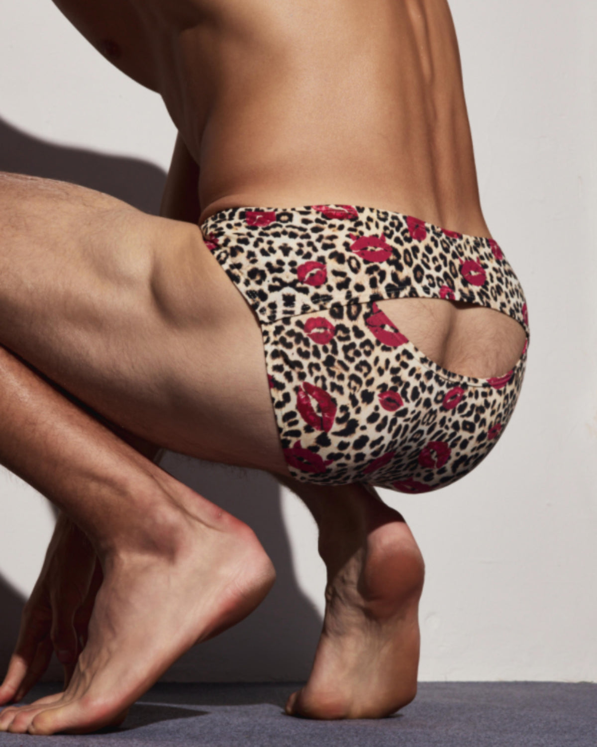 BSZN Wild Kiss Animal-Print Cutout Brief — Brown leopard rear opening on seated model.