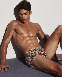 BSZN Wild Kiss Open-Back Trunk — Brown leopard front on seated model.