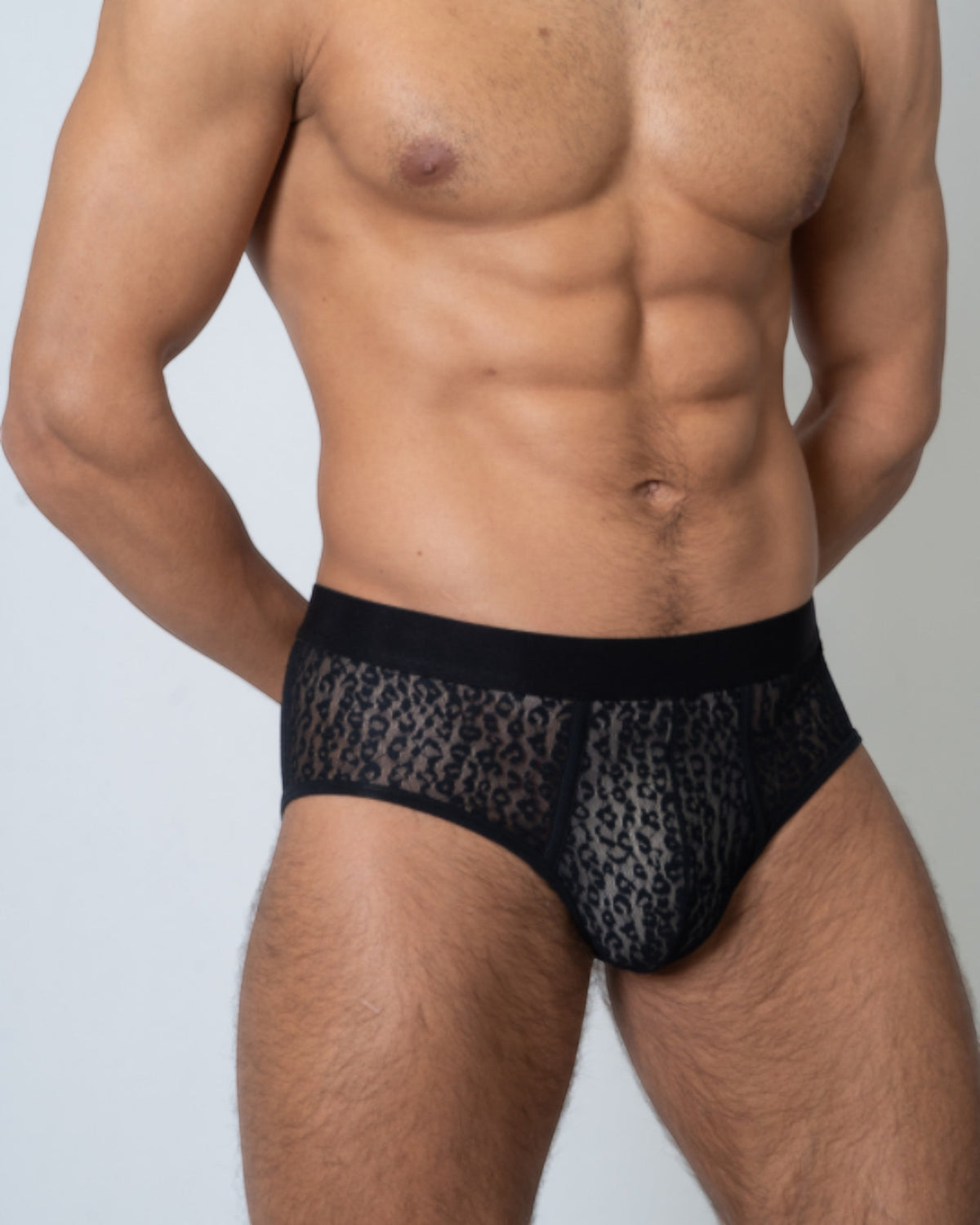 Model wearing the black BSZN Sheer Leopard Mesh Brief, front view