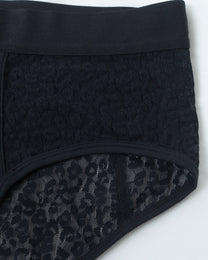 Close-up of the black BSZN brief waistband, leopard mesh and bound leg opening