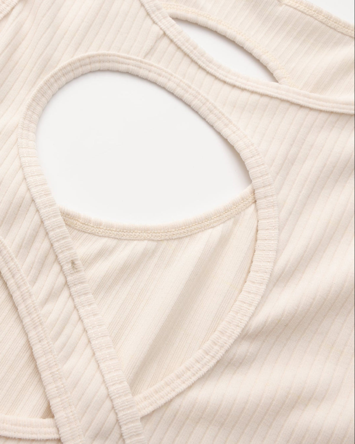BSZN Asymmetric Cutout Ribbed Tank Top, bound oval cutout and diagonal-band construction detail