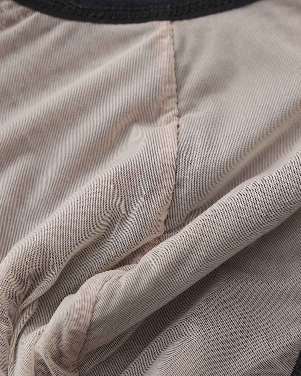 BSZN Metallic Pouch Logo Thong — Interior pouch seam detail.