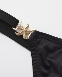 Close-up of the gold-tone starfish side clasp
