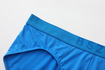 Close-up of the blue tonal BSZN waistband and micro-rib fabric