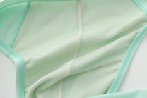 Close-up of the green brief's inner seam construction