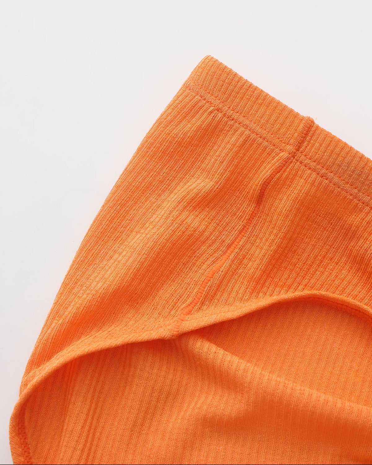 BSZN Crystal Veil V-Sculpt Brief — Orange waist and leg opening detail.