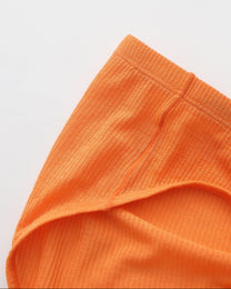 BSZN Crystal Veil V-Sculpt Brief — Orange waist and leg opening detail.