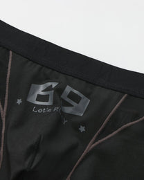 Close-up of the black 69 graphic and smoky contrast piping