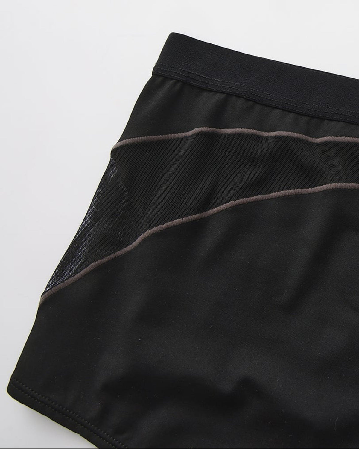 Close-up of the side mesh insert and curved contrast panel line