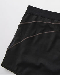 Close-up of the side mesh insert and curved contrast panel line