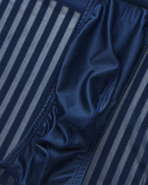 Close-up of the gathered pouch edge beside the vertical mesh stripes