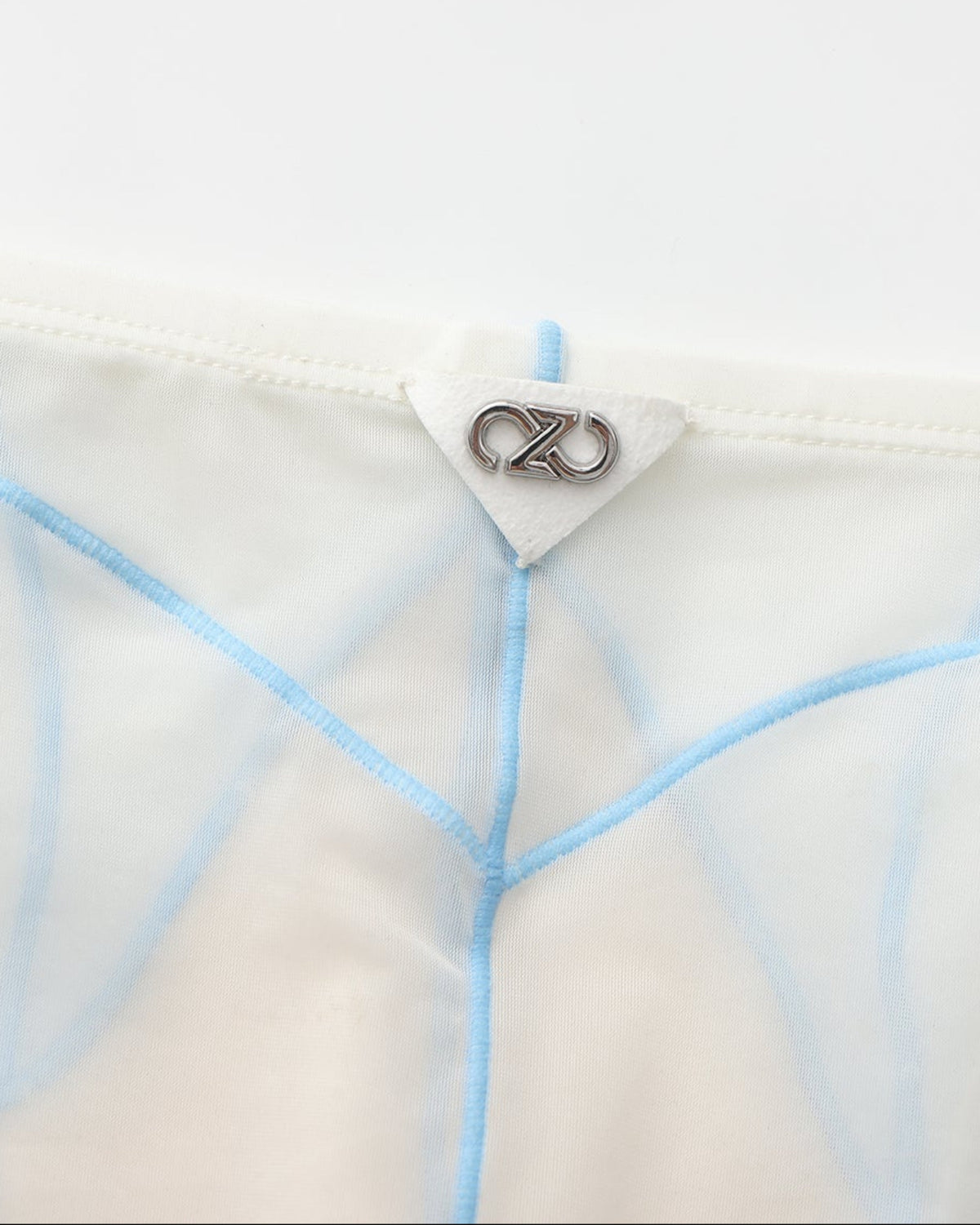 BSZN Sheer Contrast-Seam Brief — White rear metal logo detail.