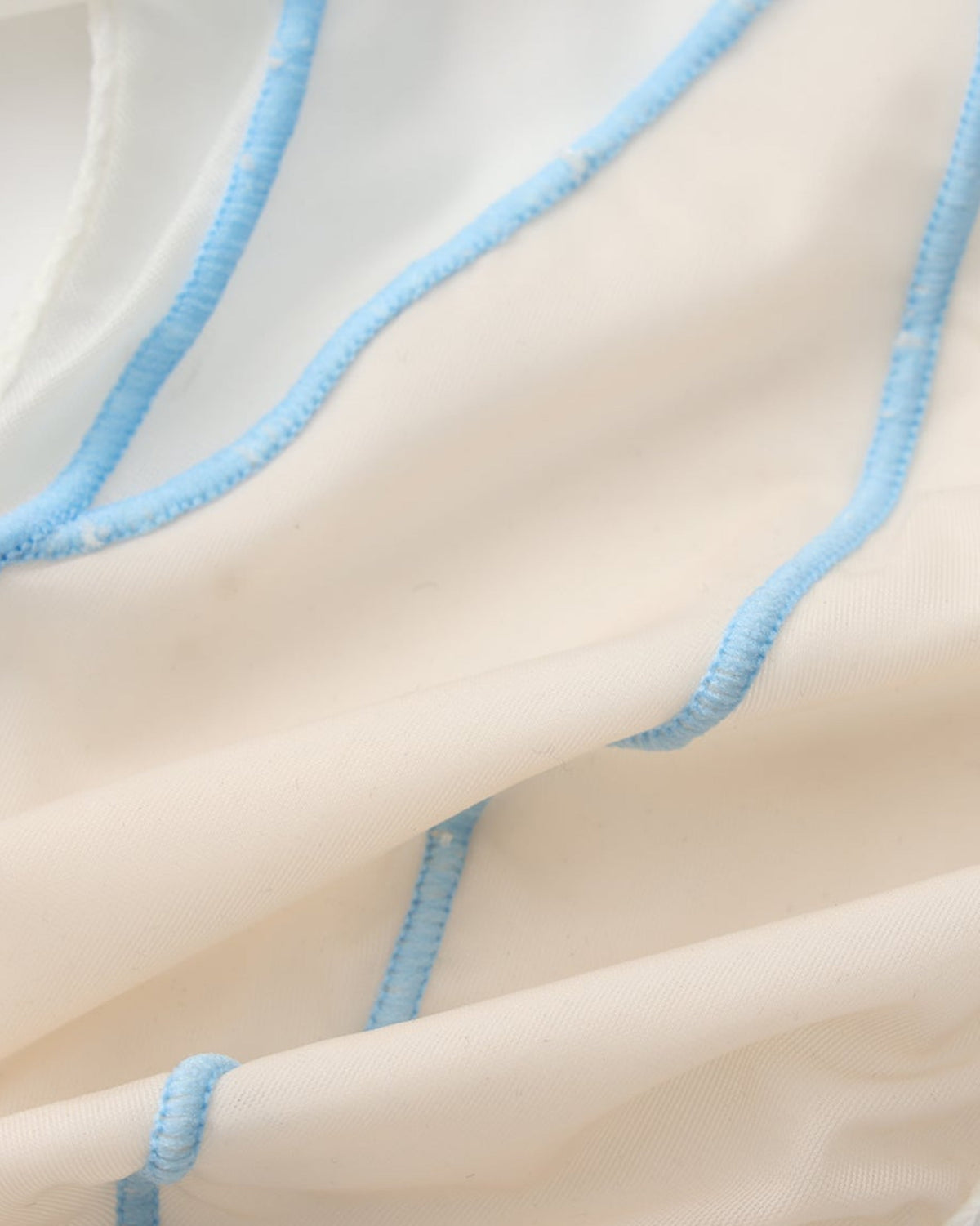 BSZN Sheer Contrast-Seam Brief — White seam and fabric close-up.