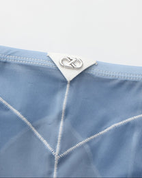 BSZN Sheer Contrast-Seam Brief — Blue rear metal logo and seams.