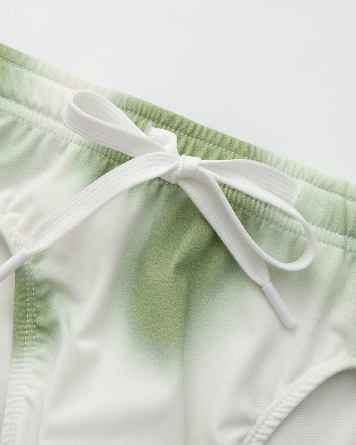 BSZN Dappled Print Swim Brief — Green drawstring waist detail.