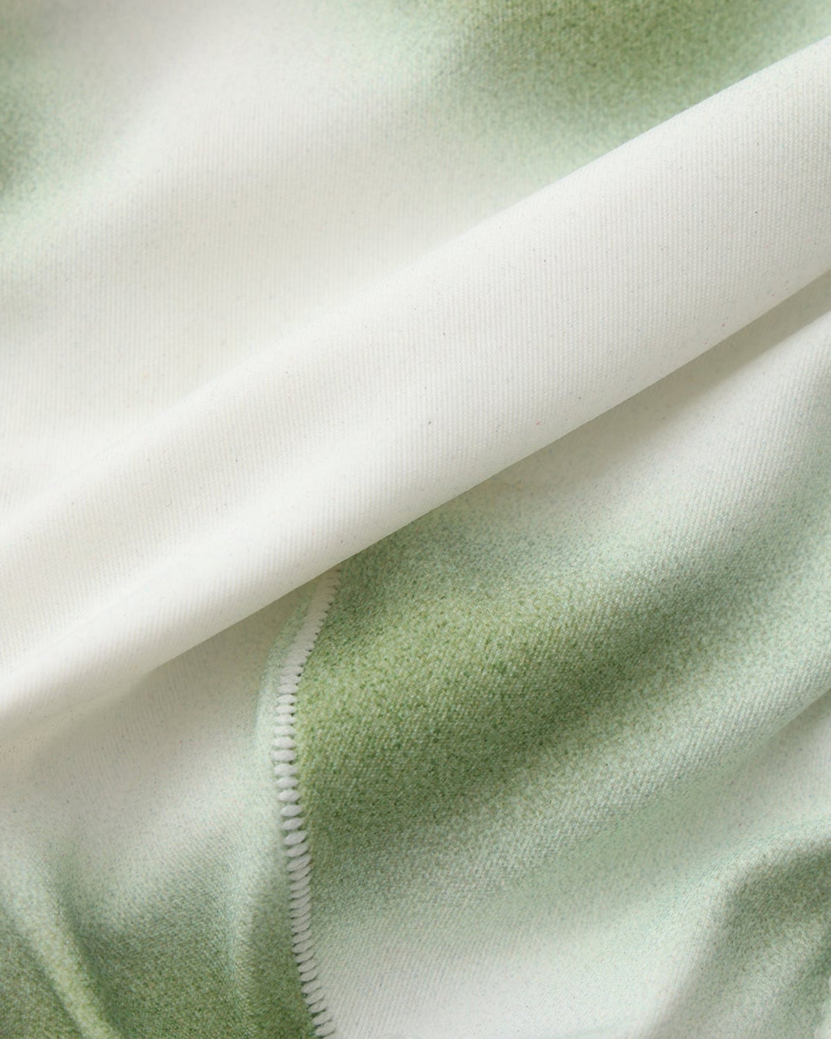 BSZN Dappled Print Swim Brief — Green print and seam close-up.