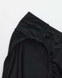 BSZN Shimmer Mesh V-Waist Chain Brief — Black leg opening and mesh detail.