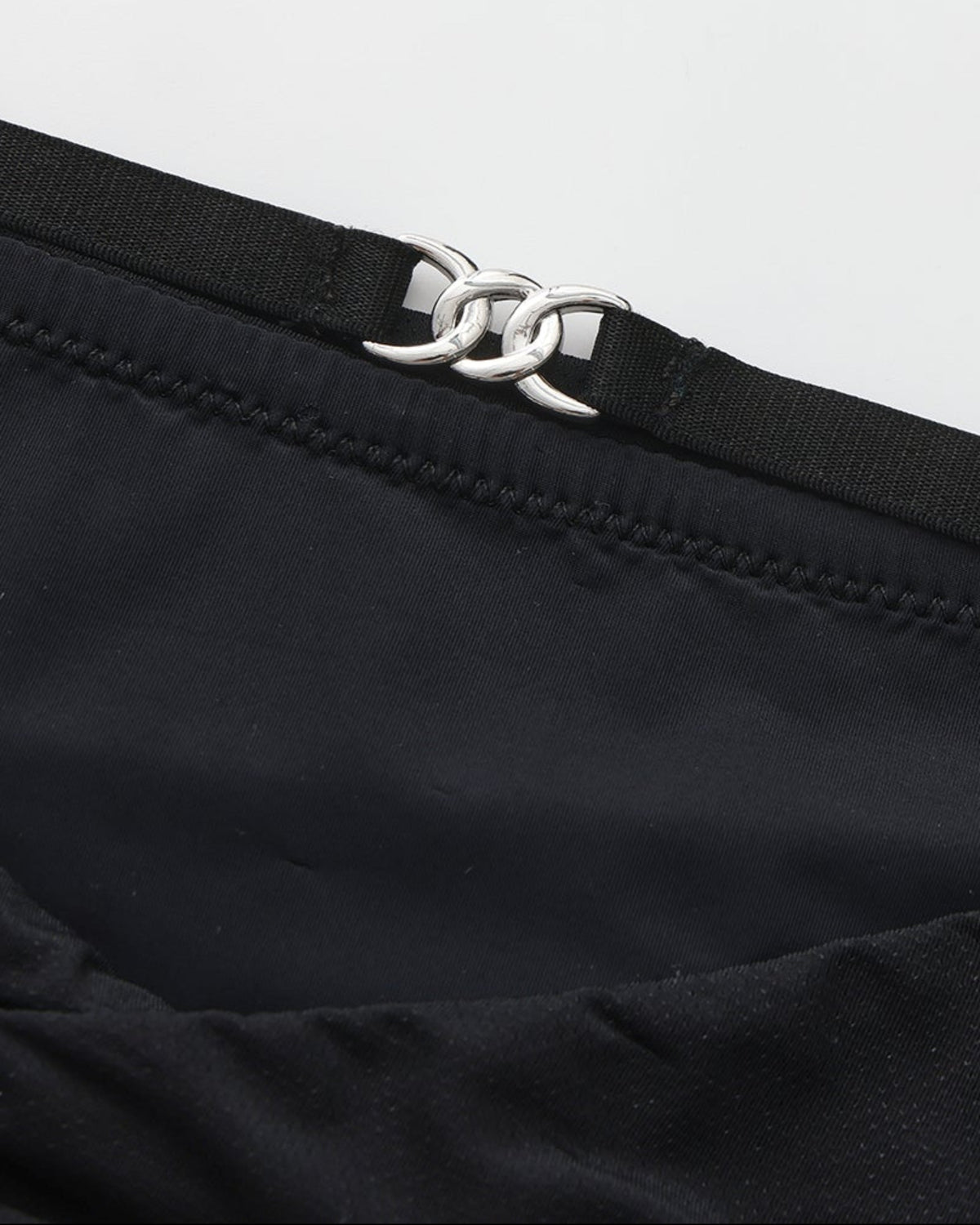 BSZN Shimmer Mesh V-Waist Chain Brief — Black metal-link waist detail.