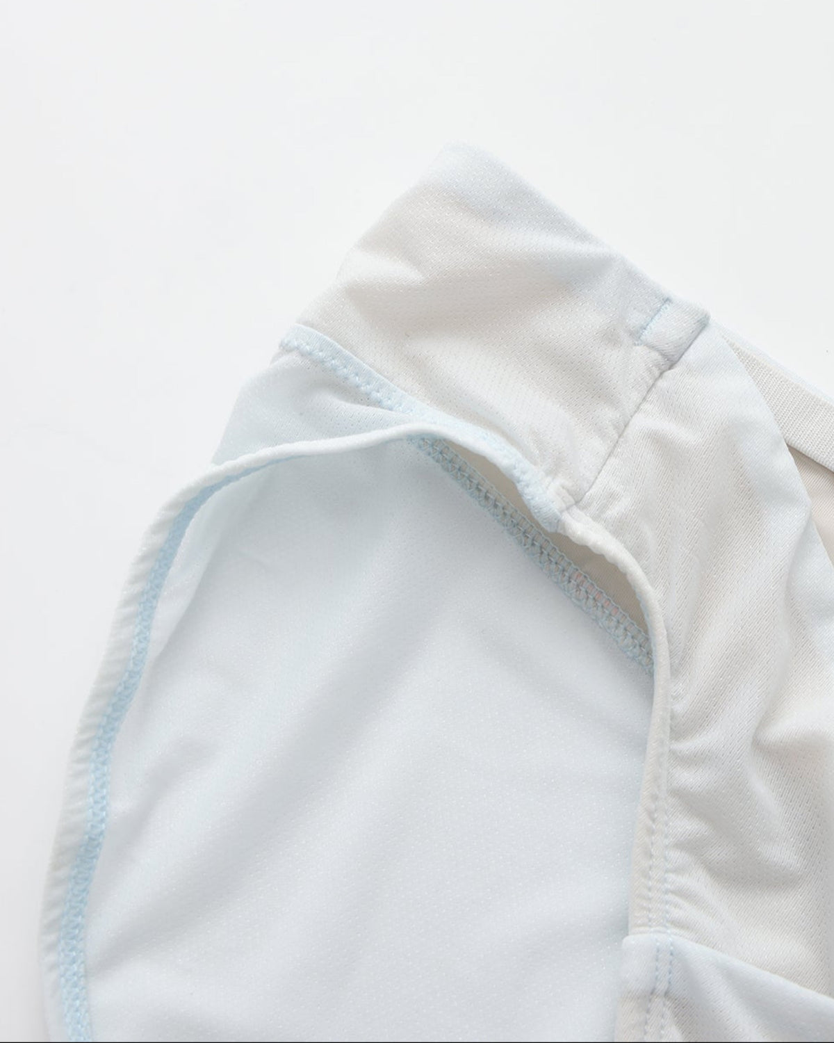BSZN Shimmer Mesh V-Waist Chain Brief — Pale blue leg opening detail.