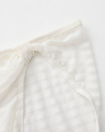 Close-up of the gathered side seam on the white stripe mesh