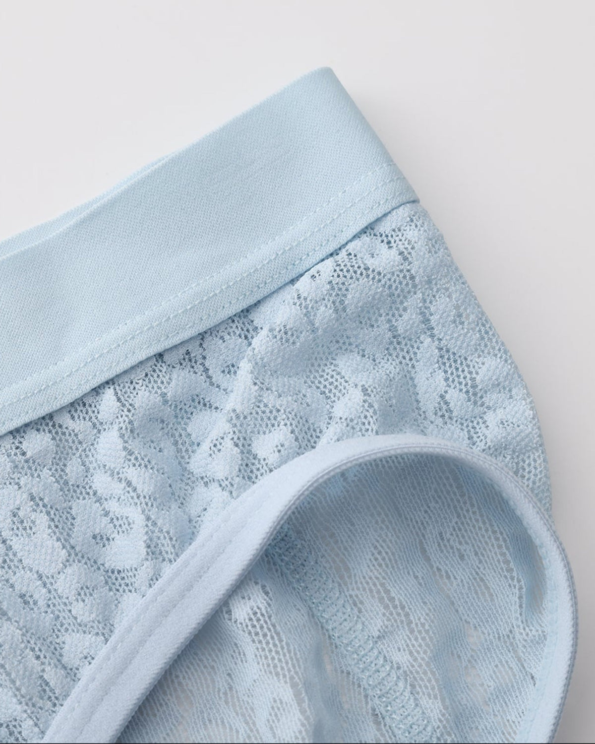 Close-up of the pale blue BSZN brief waistband and leopard-mesh leg opening