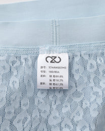 Close-up of the pale blue BSZN brief inner care label and waist seam