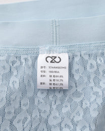 Close-up of the pale blue BSZN brief inner care label and waist seam