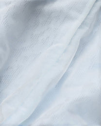 Close-up of the pale blue leopard mesh and opaque pouch-lining edge