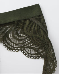 Close-up of the green waistband and swirl-pattern lace