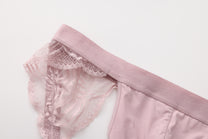 Close-up of pink scalloped lace framing and elastic waistband