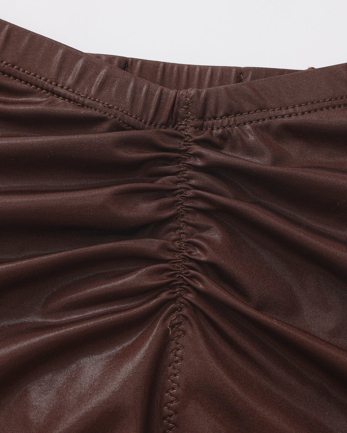 Close-up of the dipped waistband and gathered rear seam on the brown BSZN brief