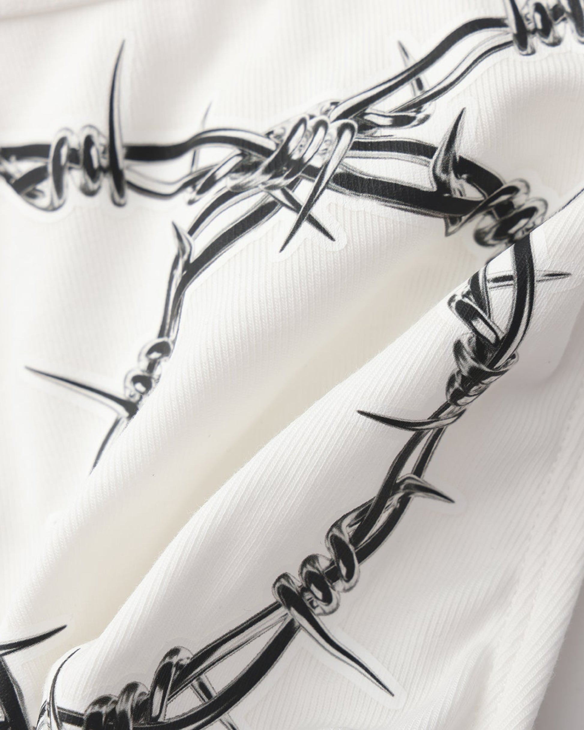 BSZN Thorn Print Thong, white barbed-wire print detail