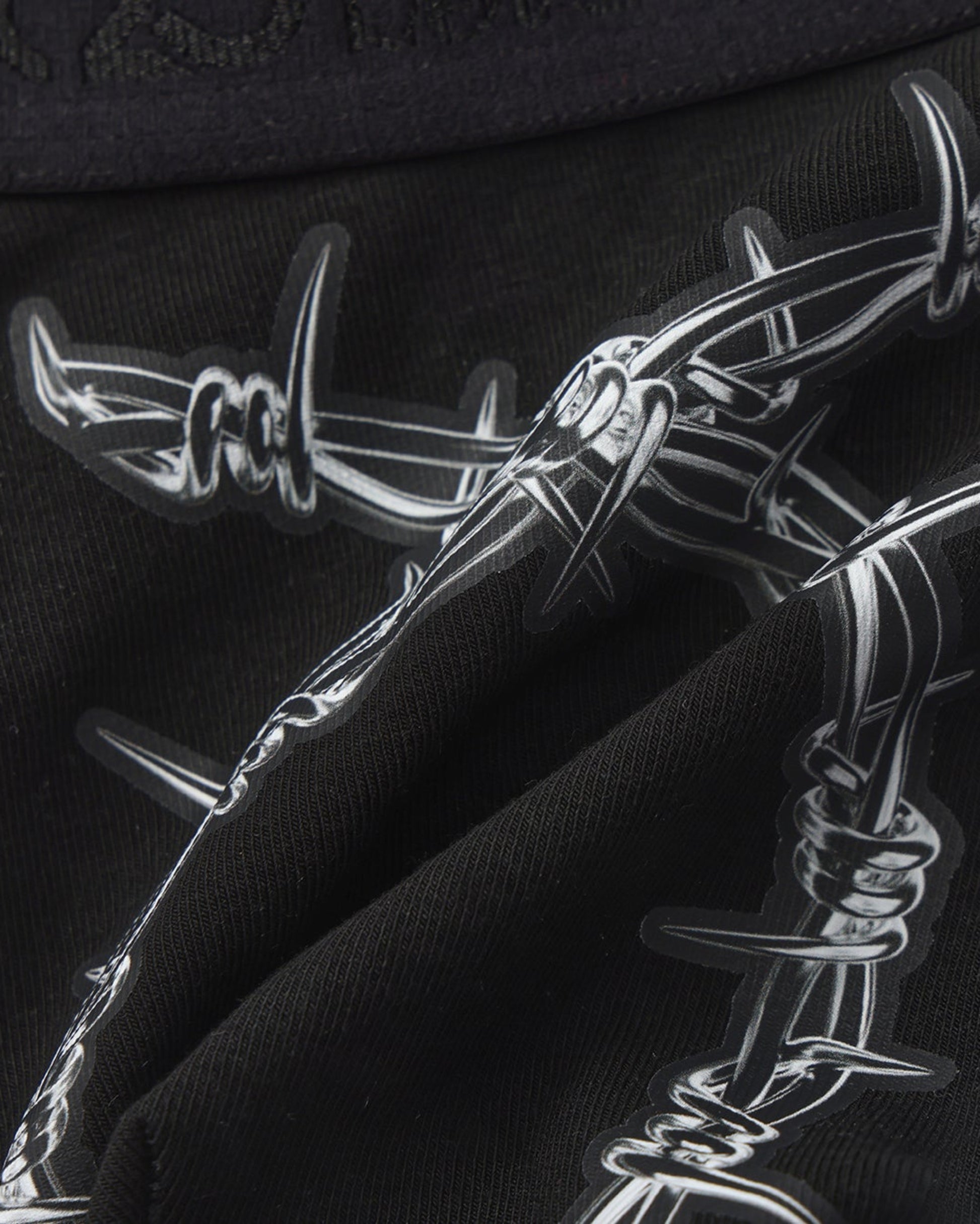 BSZN Thorn Print Thong, black barbed-wire print detail