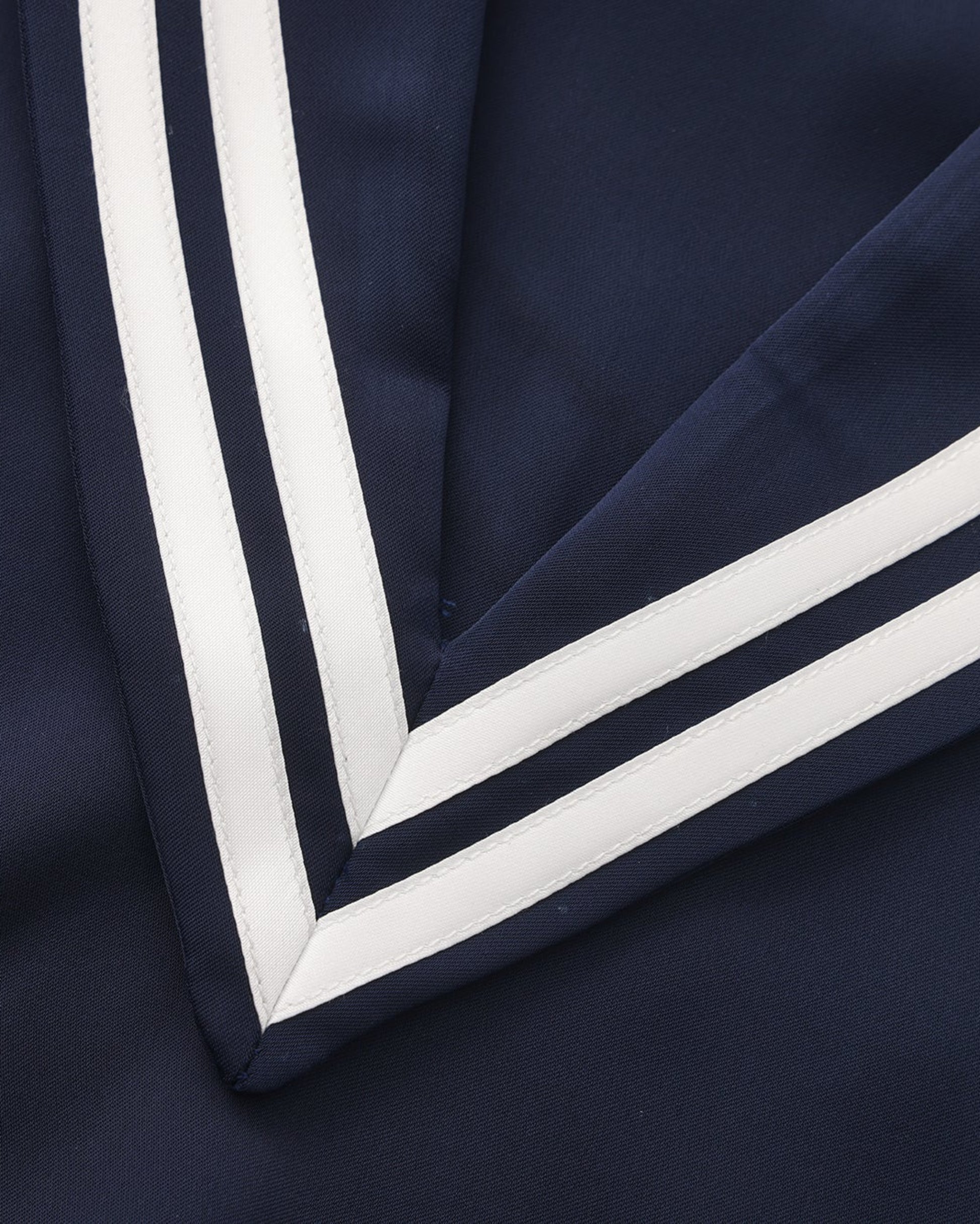 Close-up of the deep V-neck and double white sailor stripes