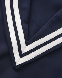 Close-up of the deep V-neck and double white sailor stripes