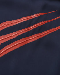 Close-up of the raised red claw-mark applique texture