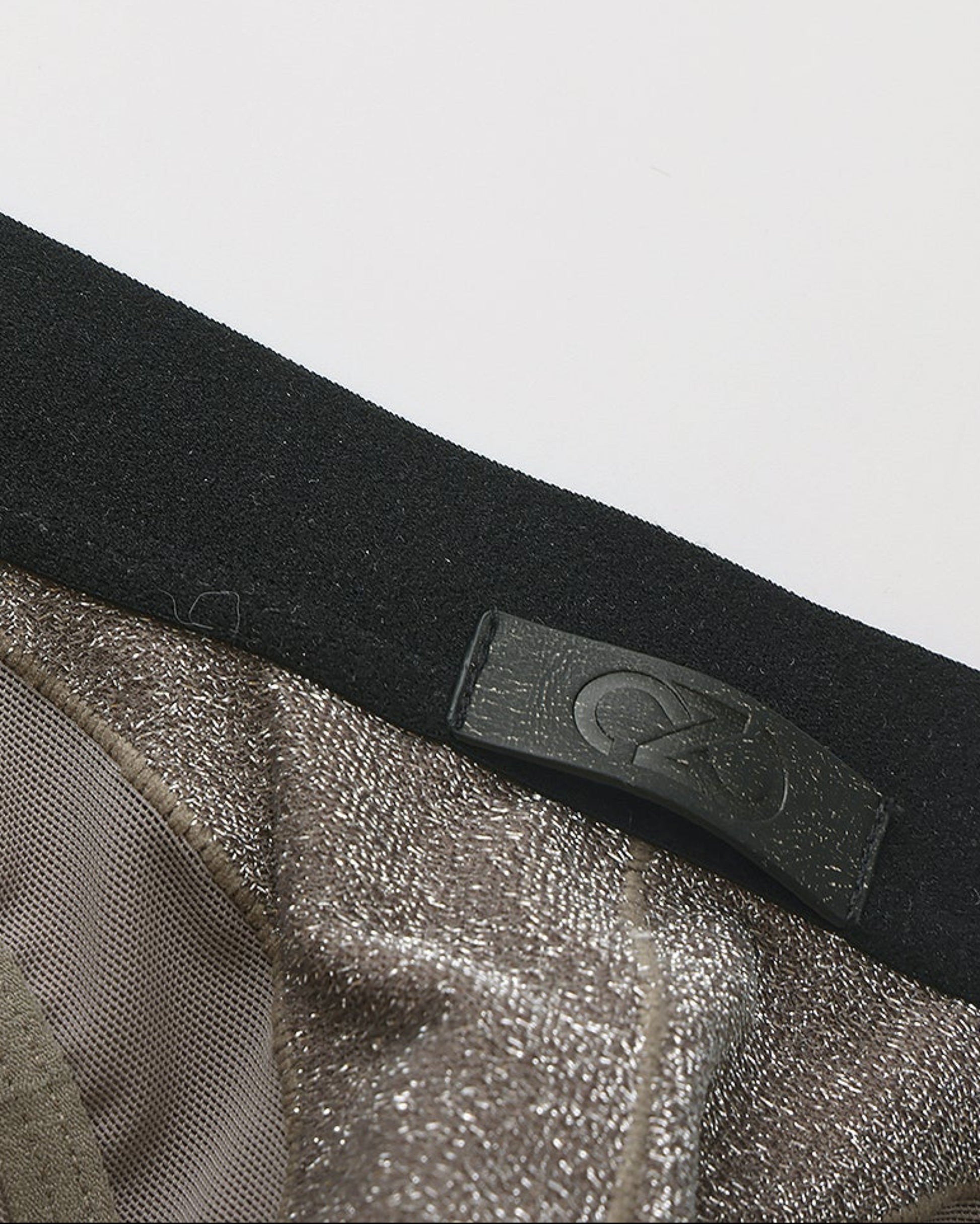 Close-up of the black waistband and BSZN logo tab