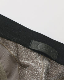 Close-up of the black waistband and BSZN logo tab