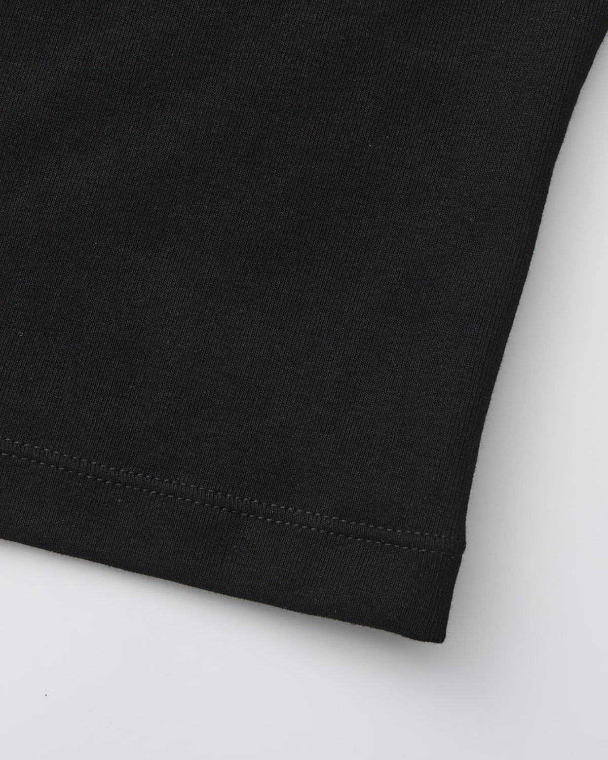 BSZN Black tank hem stitching, close-up.