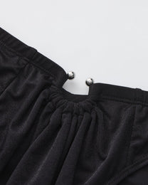BSZN Shimmer Horseshoe Ring Brief — Black horseshoe ring close-up.