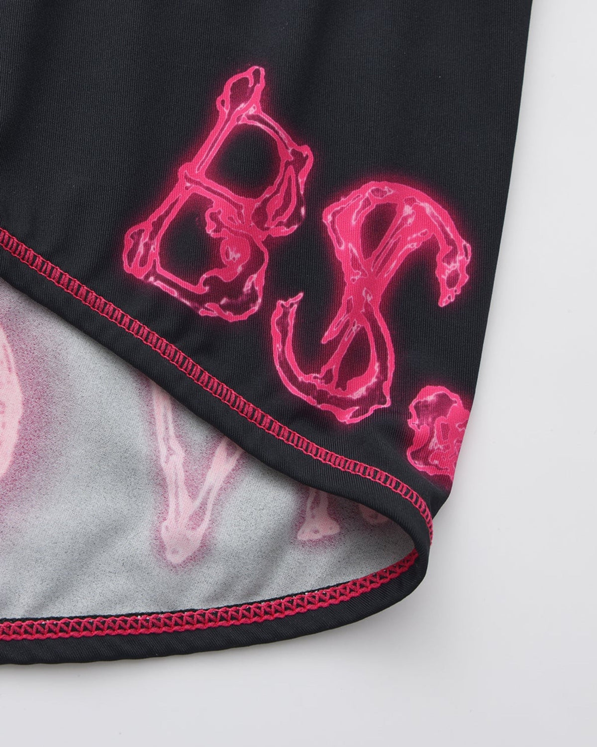 BSZN Printed leg edge and pink stitching, close-up.