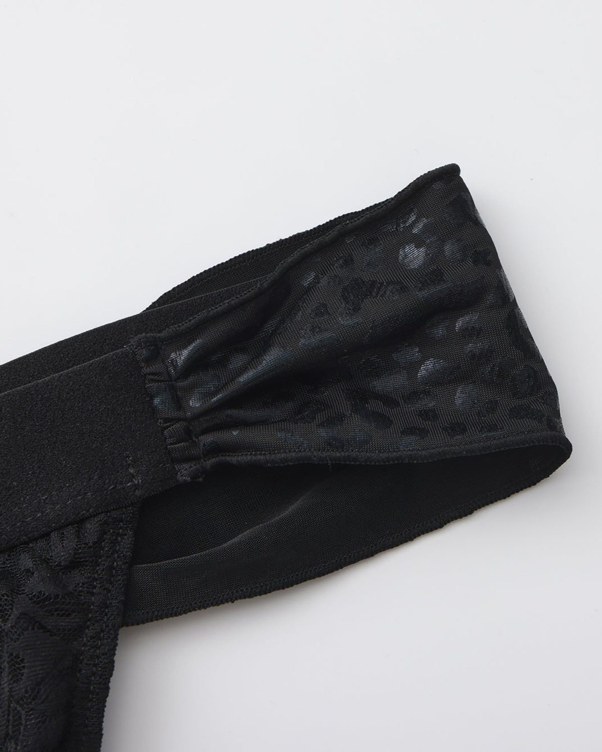 BSZN Glossy leopard-pattern tie and waistband attachment, close-up.