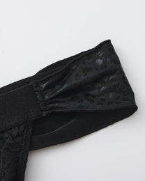 BSZN Glossy leopard-pattern tie and waistband attachment, close-up.