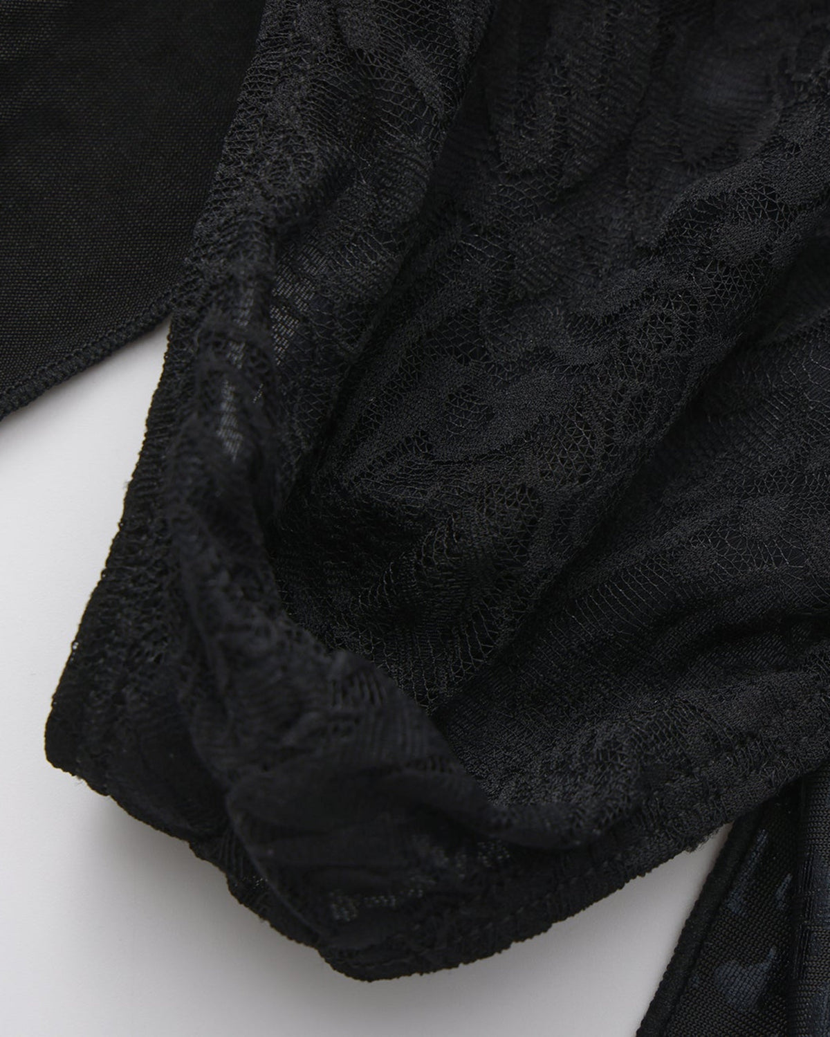 BSZN Patterned black lace pouch, close-up.